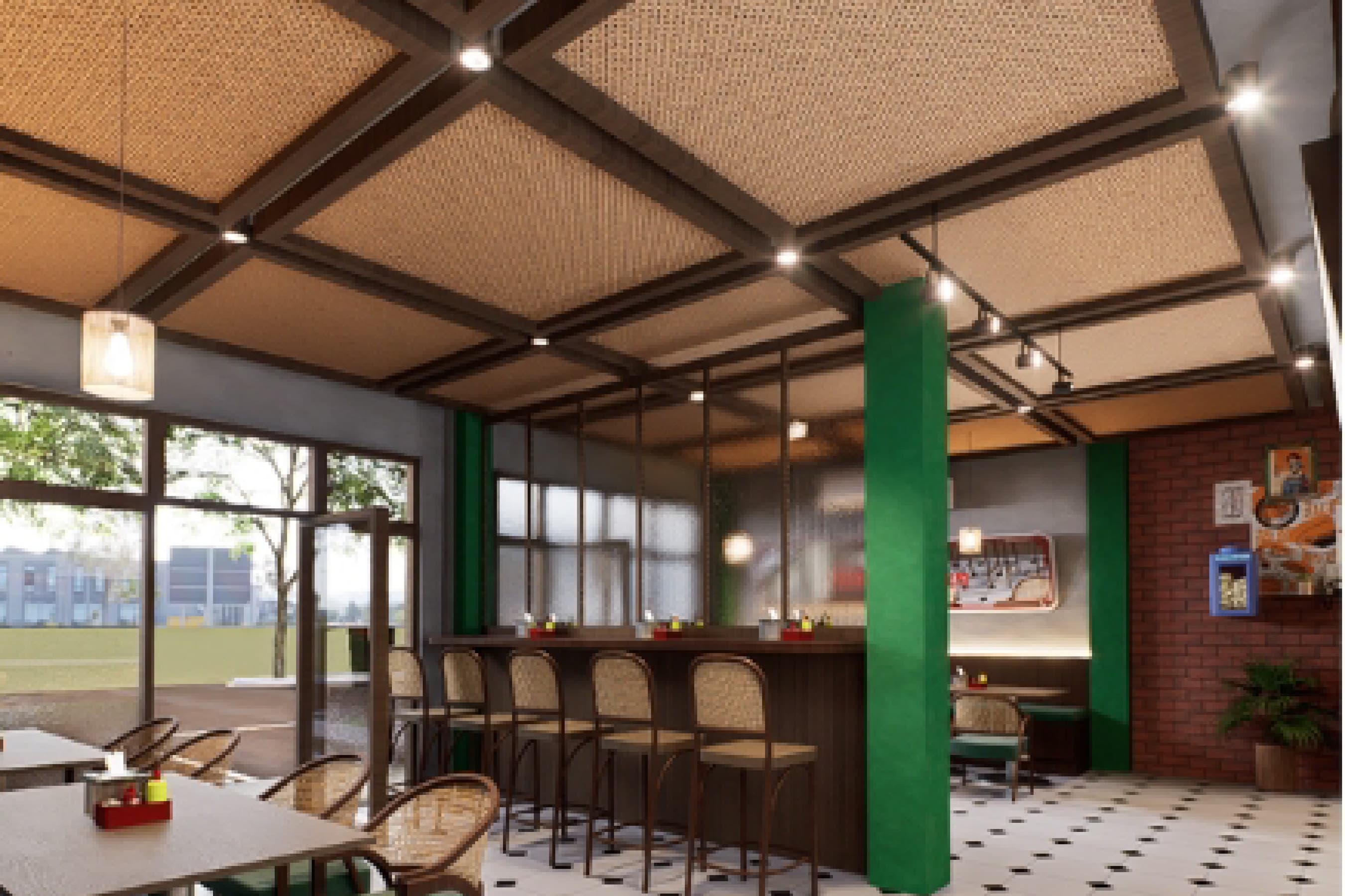 Wide view of the dining hall with green structural columns, bar seating and potted plants along the aisle.