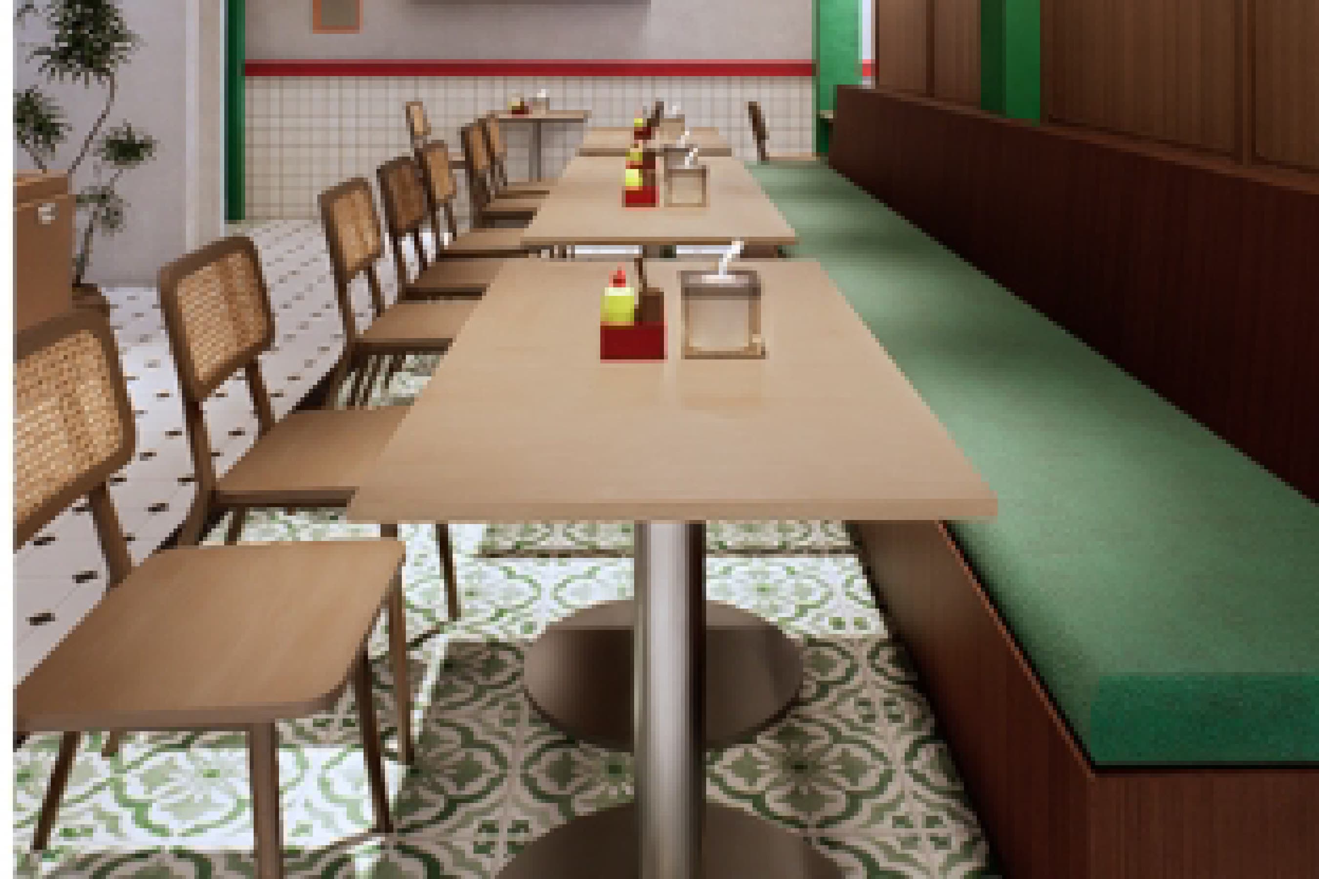 Booth seating upholstered in green, set against a patterned tile floor along the dining room wall.