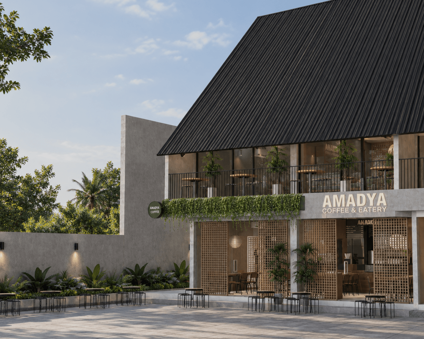 The shophouse front: a steep black roof over glazing and timber screens, a planted ledge and the AMADYA Coffee & Eatery sign.