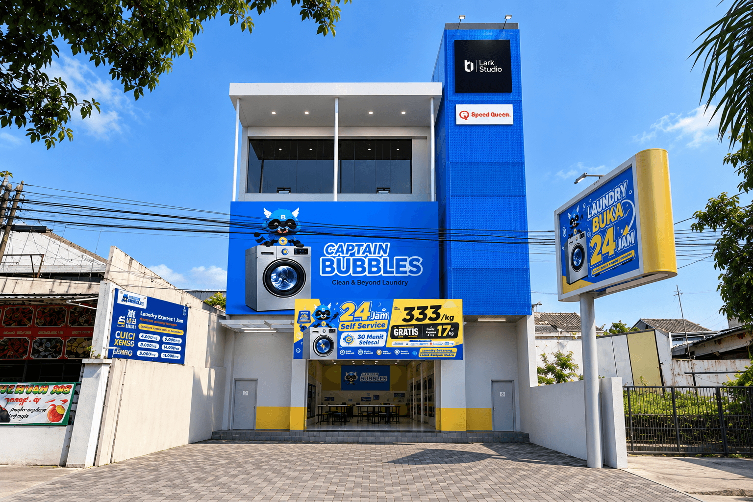 Capt Bubbles Laundry by day: a three-storey facade in blue with the mascot sign, 24-hour signage and a pylon sign at the street.