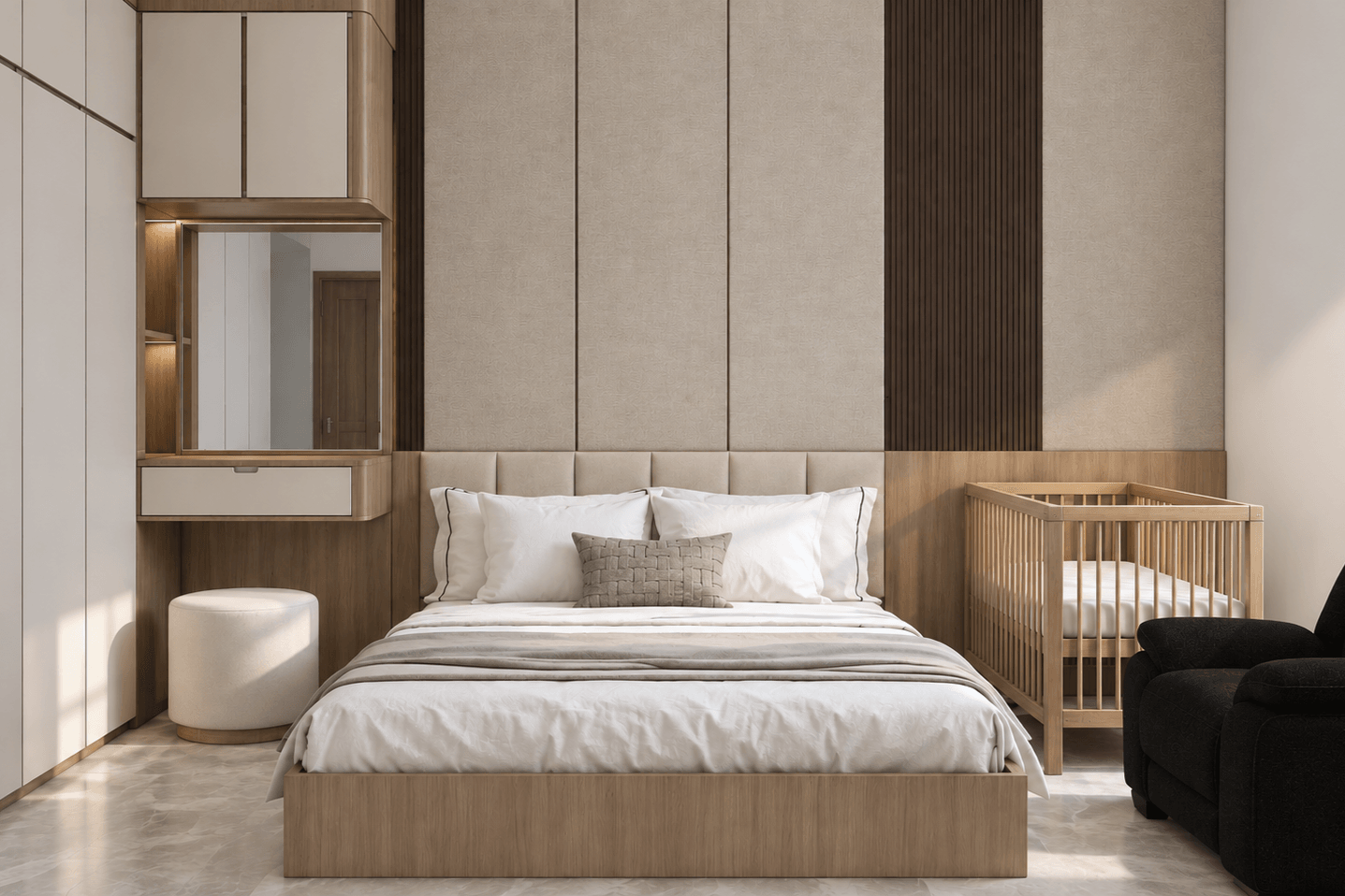 Bedroom with an upholstered headboard wall, a crib and a built-in vanity.