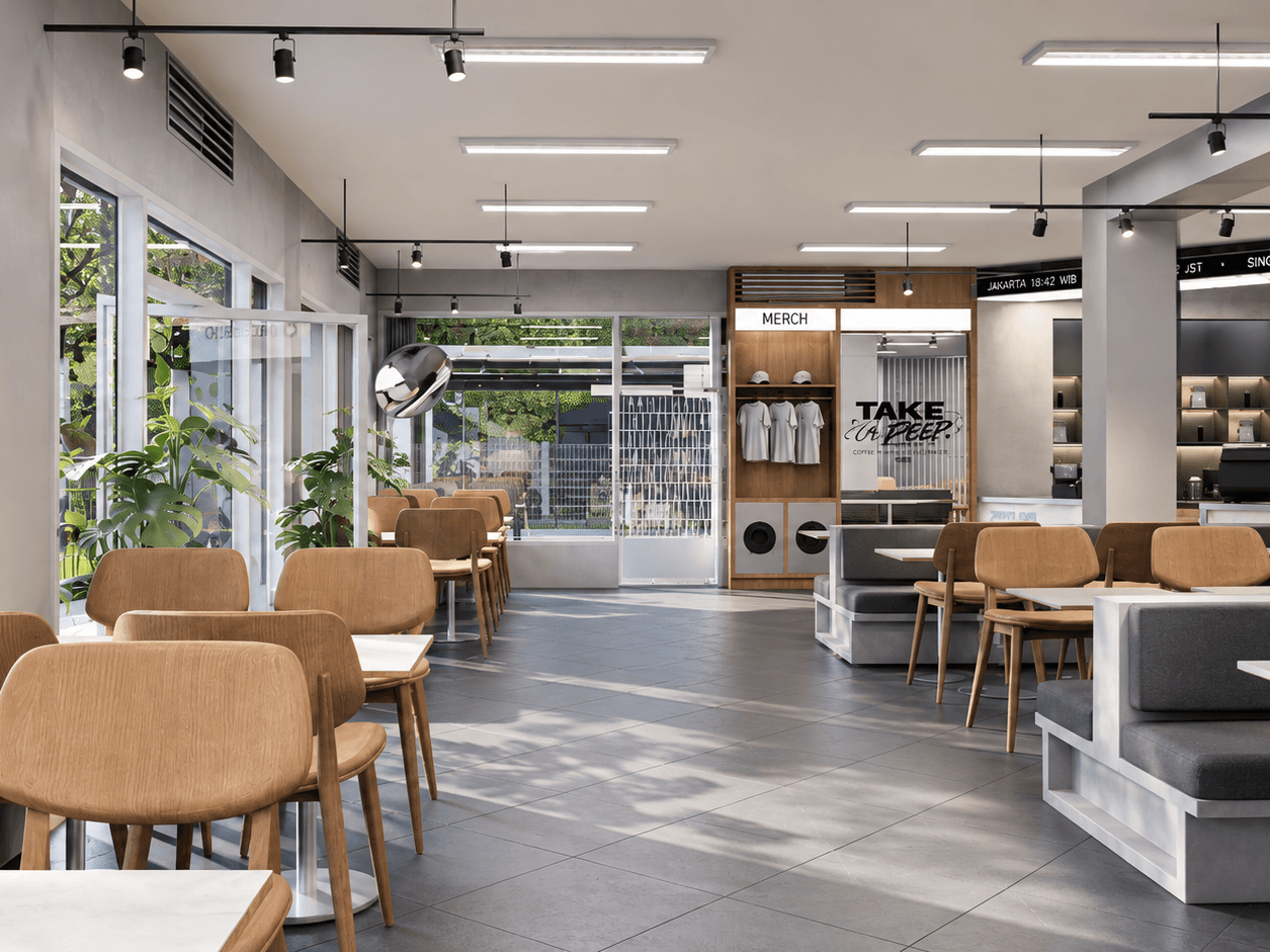 Seating along the glazed frontage: timber chairs and banquettes under linear lights.