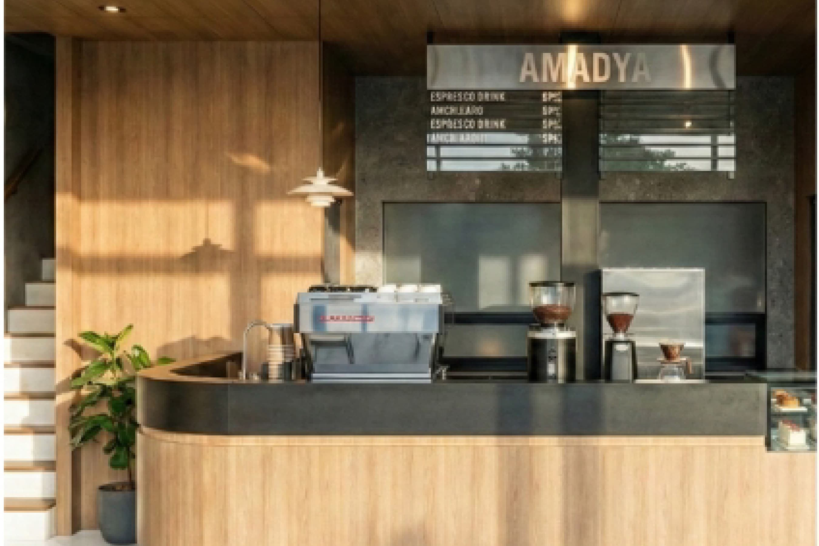 Espresso bar with timber panelling and a glass display case facing the seating area.