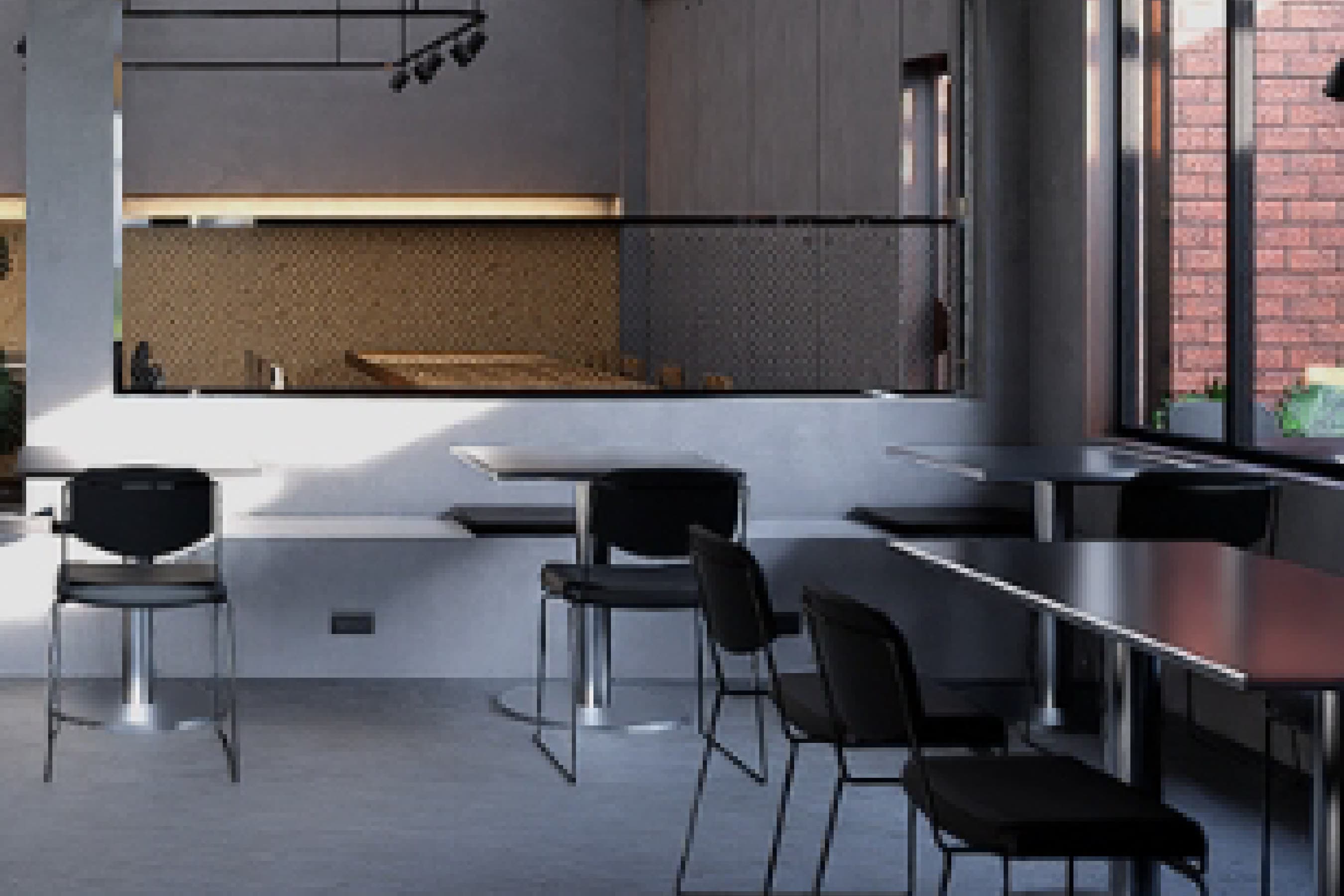 Dining area set against an exposed brick wall, with timber tables and mixed seating.