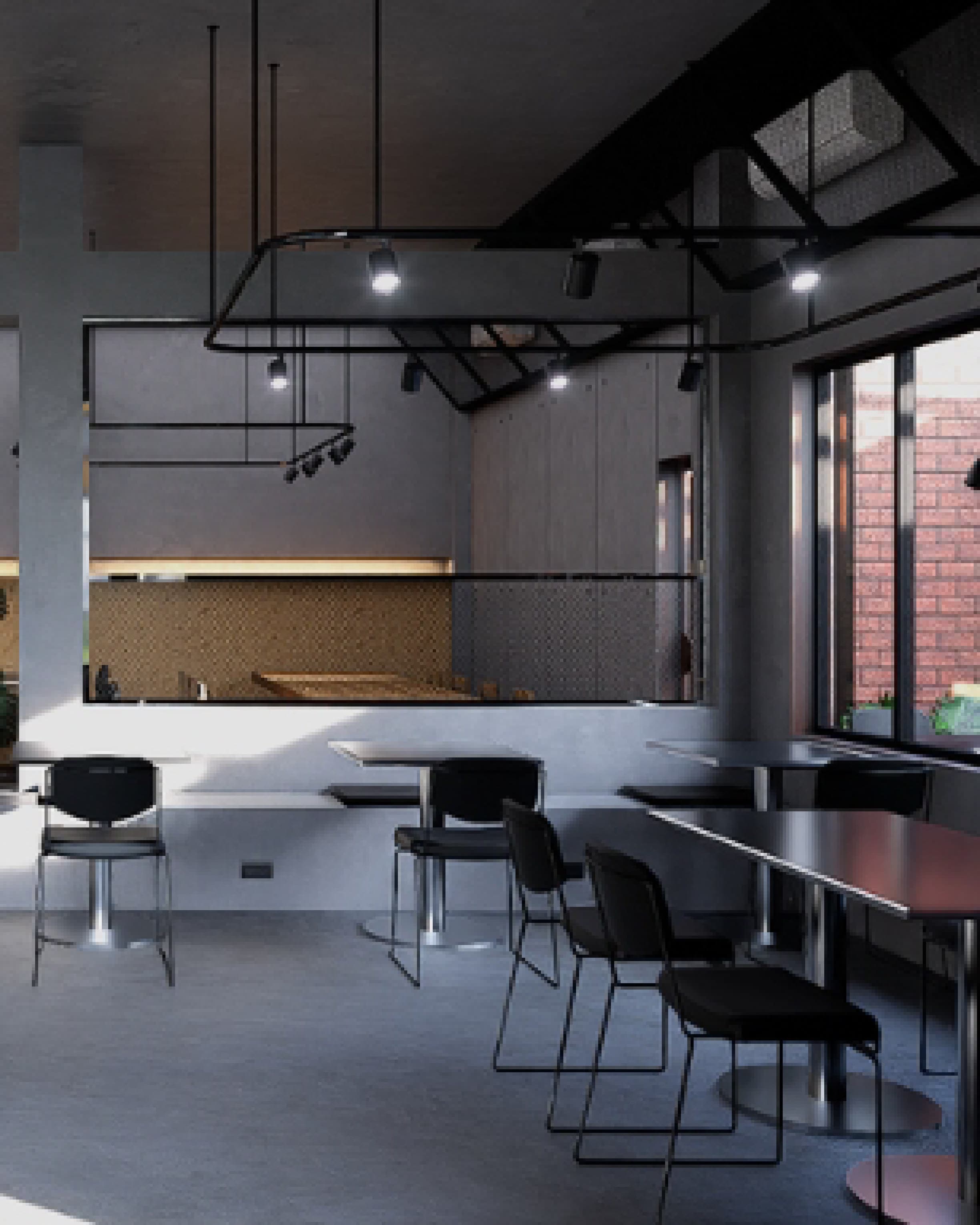 Dining area set against an exposed brick wall, with timber tables and mixed seating.
