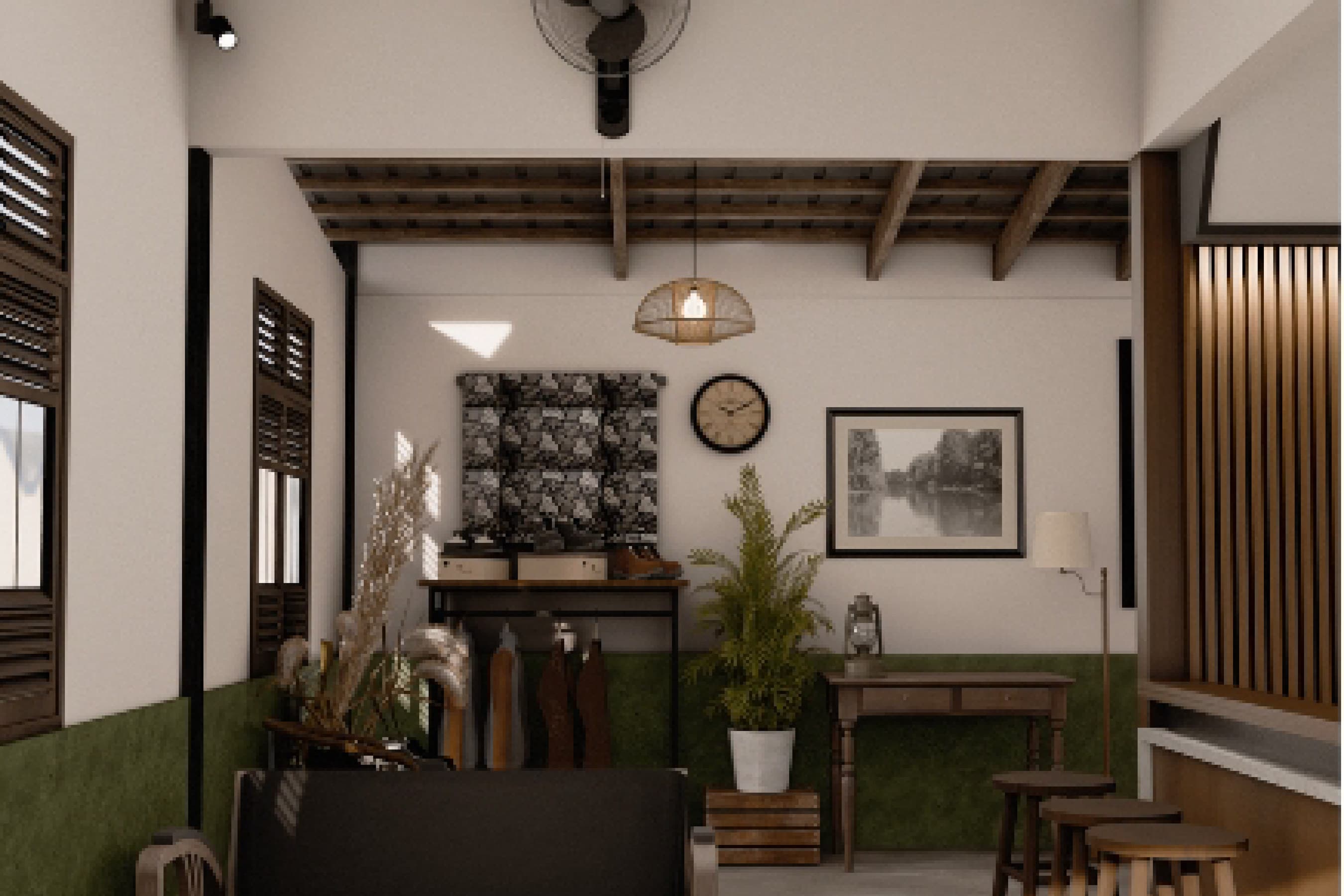 Wide interior view with exposed timber roof beams, framed pictures on the wall and potted plants.