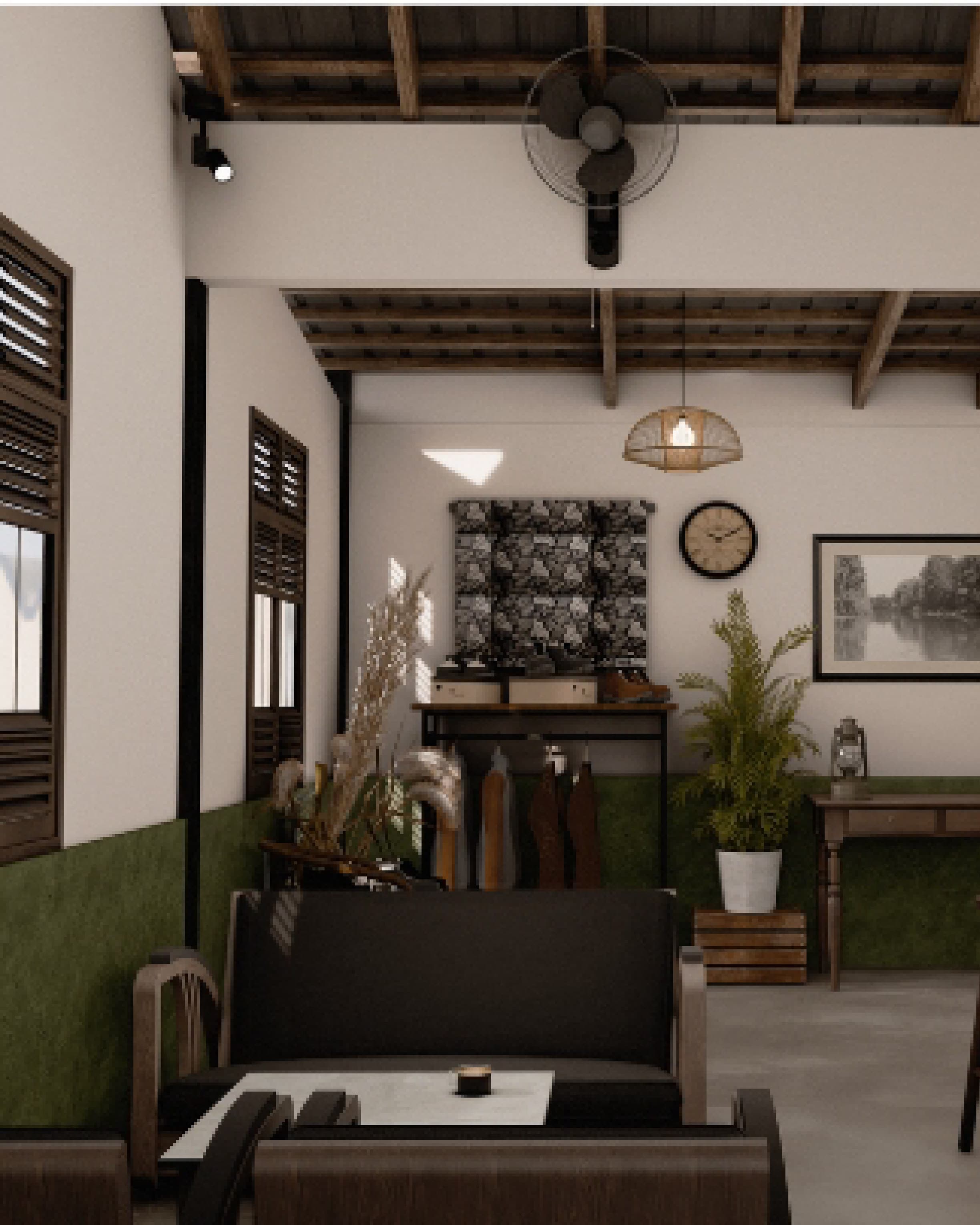 Wide interior view with exposed timber roof beams, framed pictures on the wall and potted plants.