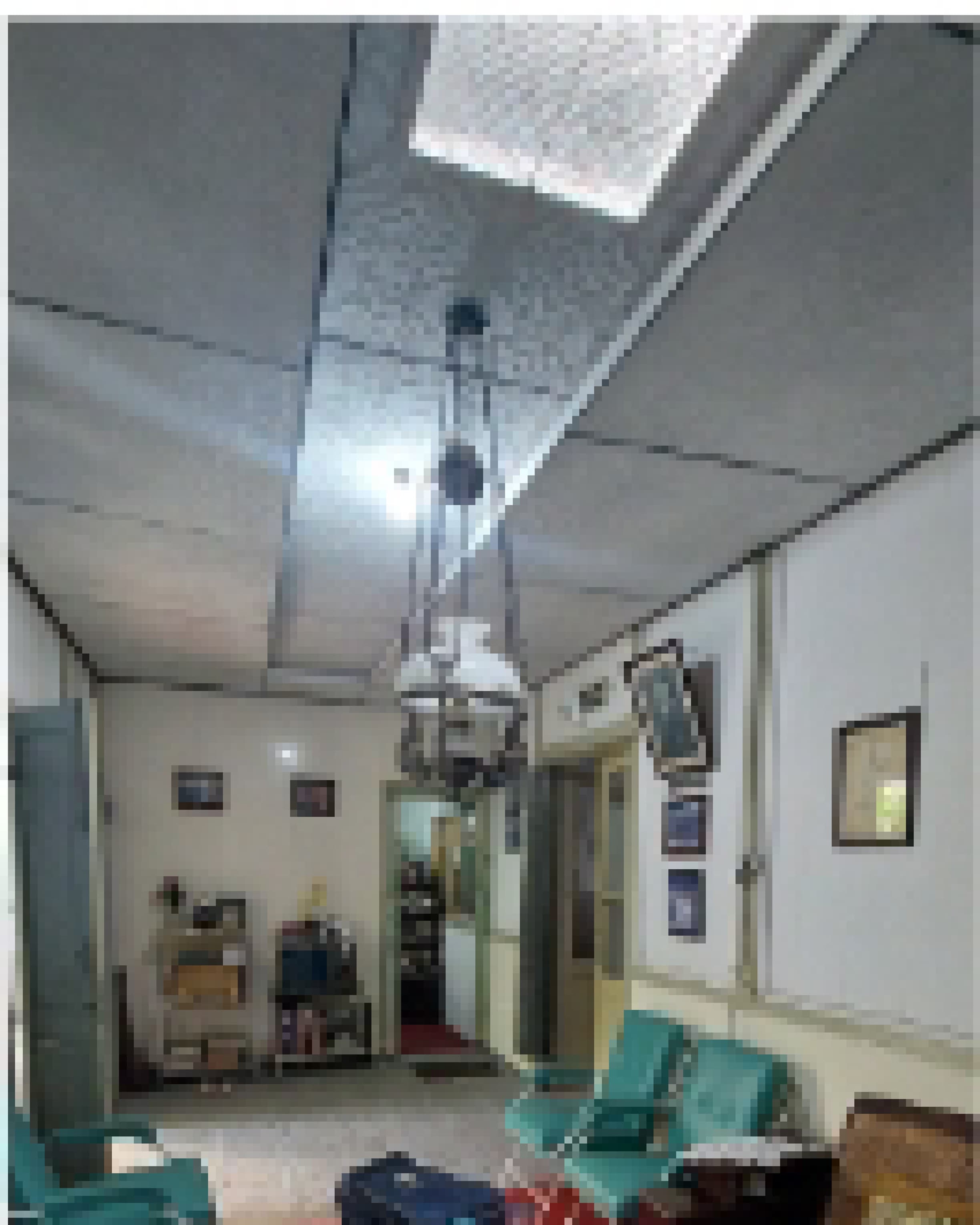 Close site documentation of the roof structure and skylight during renovation.